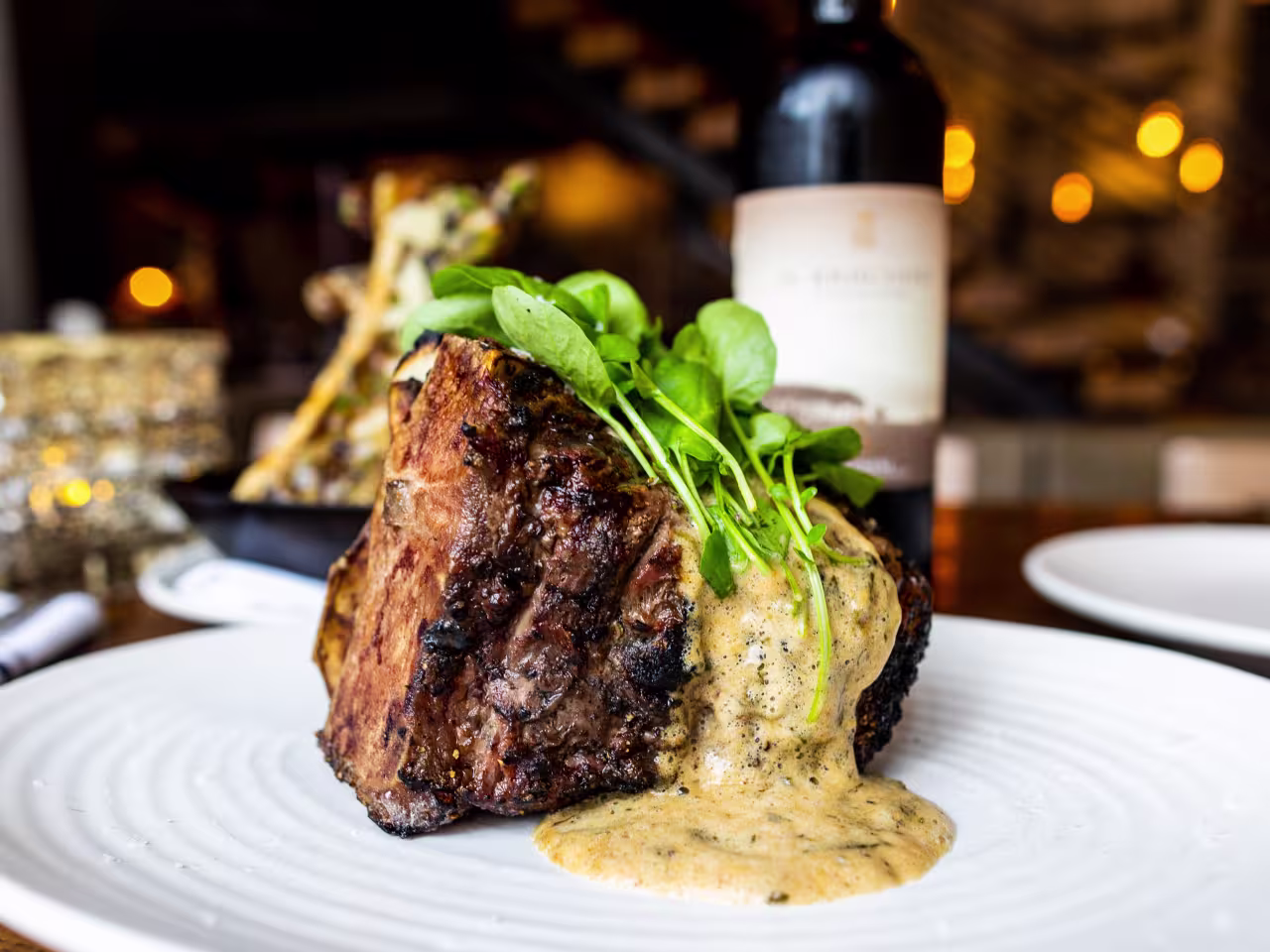 Red Ash Italia signature dishes Bone-in Filet MignonProsciutto San DanieleRed Ash LasagnaWood-Grilled Octopus